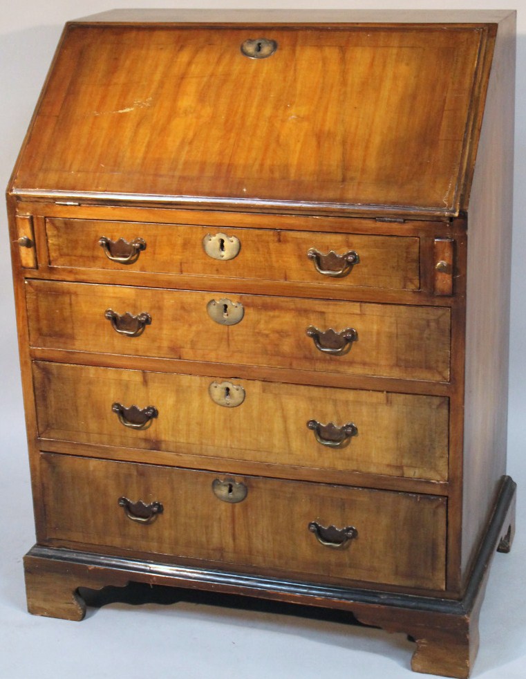 Appraisal: A mid- thC walnut veneered bureau the fall front with