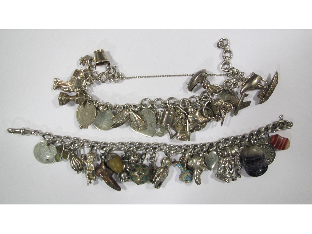 Appraisal: Two silver charm bracelets