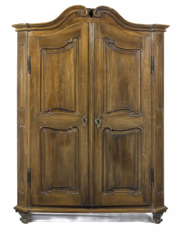 Appraisal: A CONTINENTAL CHESTNUT WARDROBE the scrolling cornice with volutes and