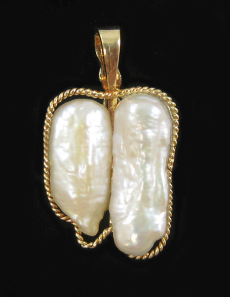 Appraisal: PEARL AND FOURTEEN KARAT GOLD PENDANT with two baroque white