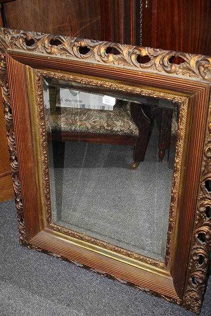 Appraisal: A PAIR OF EDWARDIAN CARVED FOLIATE MIRRORS cm x cm