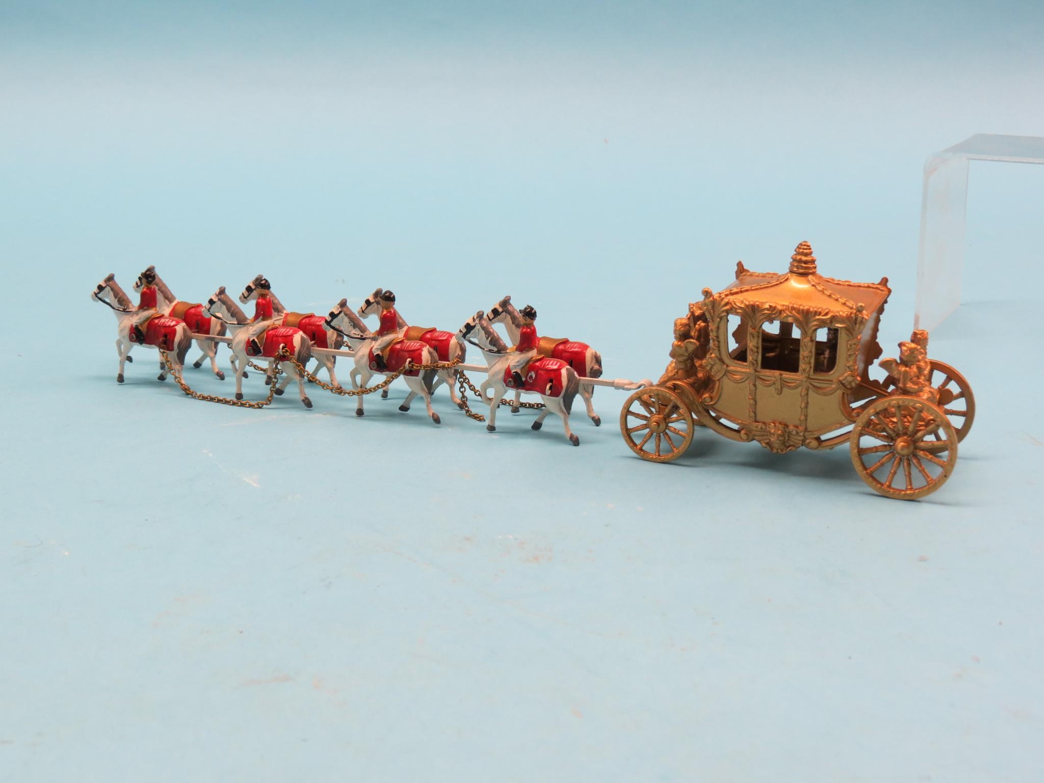 Appraisal: A die-cast coronation coach with attached team of eight greys