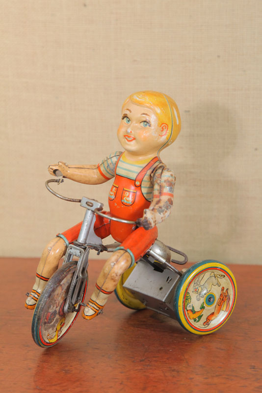 Appraisal: TIN WIND UP TOY ''Kiddy Cyclist'' lithographed boy riding a