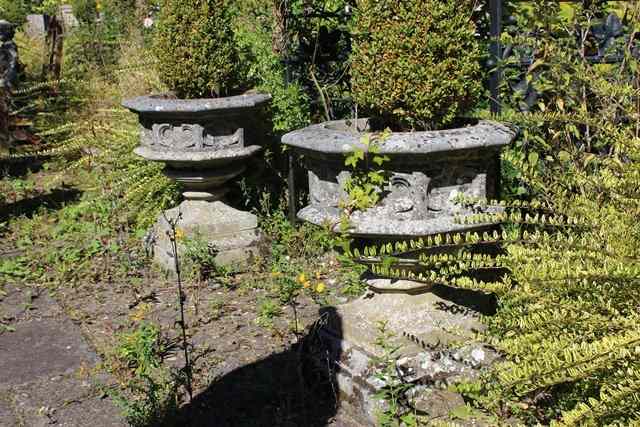 Appraisal: A PAIR OF HADDONSTONE OCTAGONAL GOTHIC STYLE PLANTERS each standing