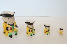 Appraisal: GROUP OF FOUR GRADUATED DEVON MOOR TOBY JUGS