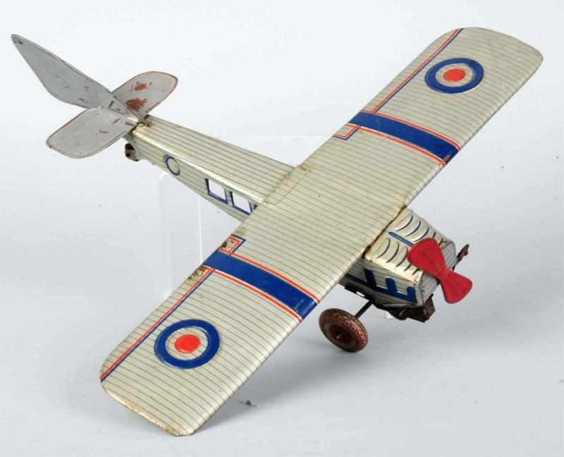 Appraisal: Tin Litho Airplane Wind-Up Toy English American Marked Made in