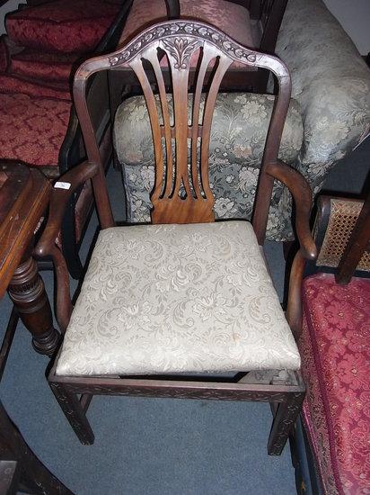 Appraisal: A GEORGE III MAHOGANY SPLAT BACK ELBOW CHAIR with carved