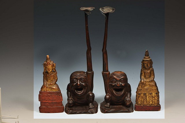 Appraisal: A PAIR OF JAPANESE CARVED WOOD CANDLESTICKS each in the