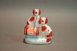 Appraisal: Three Staffordshire dogs in various shapes and colours