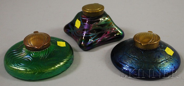 Appraisal: Three Brass-mounted Iridescent Art Glass Inkwells including Loetz-type dia to