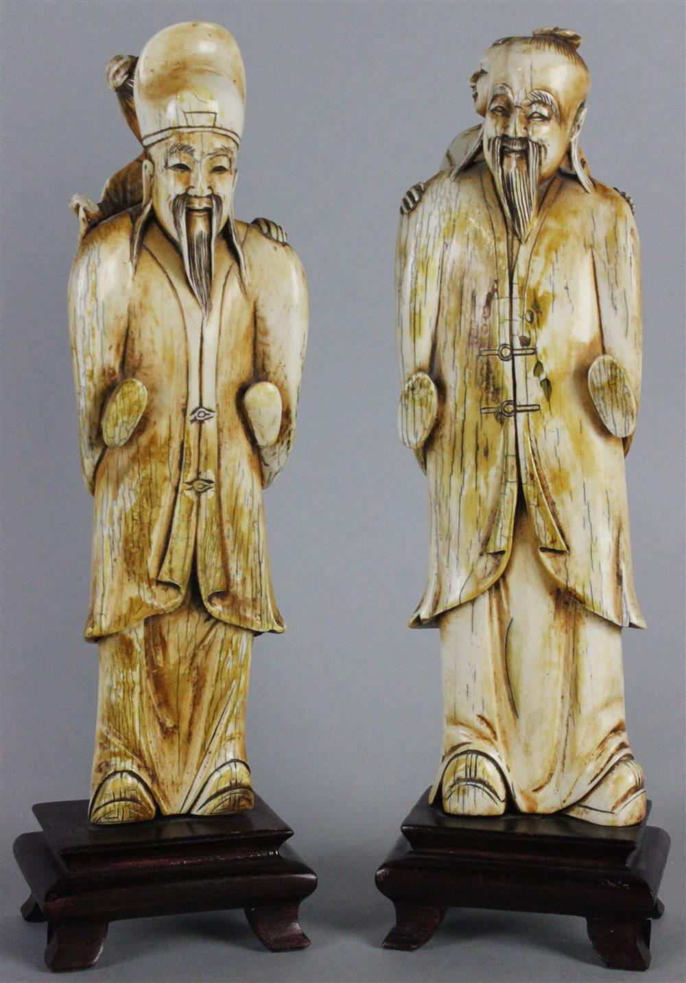 Appraisal: TWO IVORY CARVED FIGURES in the Ming taste the first