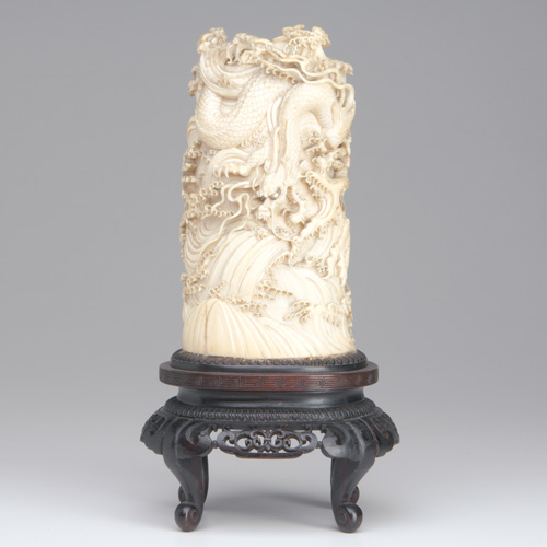 Appraisal: JAPANESE IVORY Well-carved in openwork two dragons amongst turbulent waves