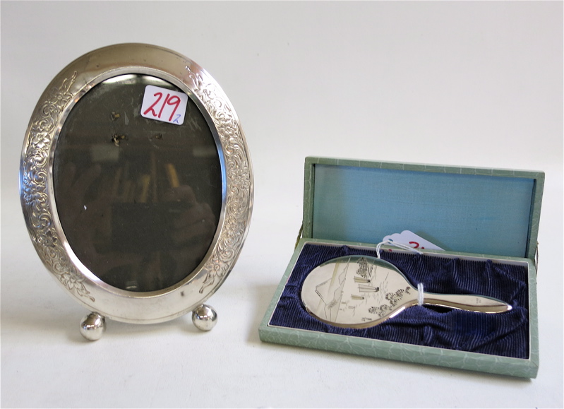 Appraisal: STERLING SILVER PICTURE FRAME AND HAND MIRROR the oval frame