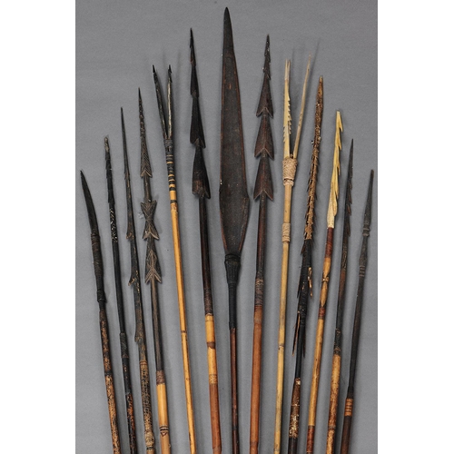 Appraisal: COLLECTION OF THIRTEEN EARLY MELANESIAN SPEARS Carved and engraved wood