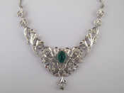 Appraisal: A white metal tests carat gold synthetic emerald and diamond