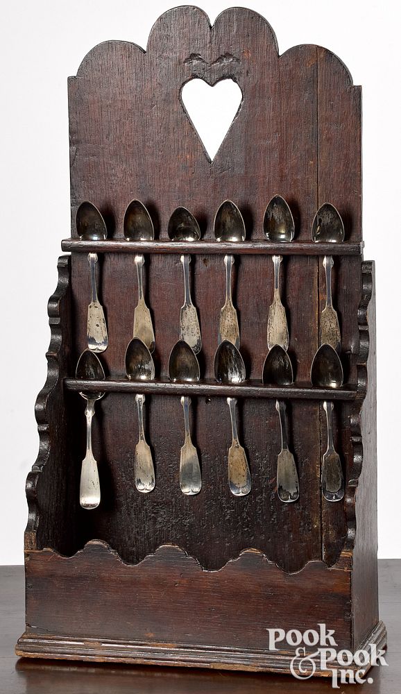 Appraisal: English oak hanging spoon rack and spoons English oak hanging