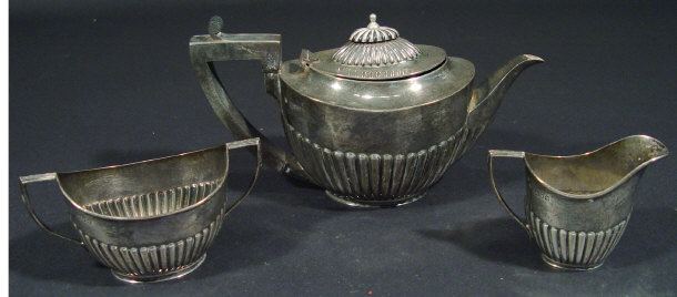 Appraisal: Three piece silver tea set with half fluted bodies the