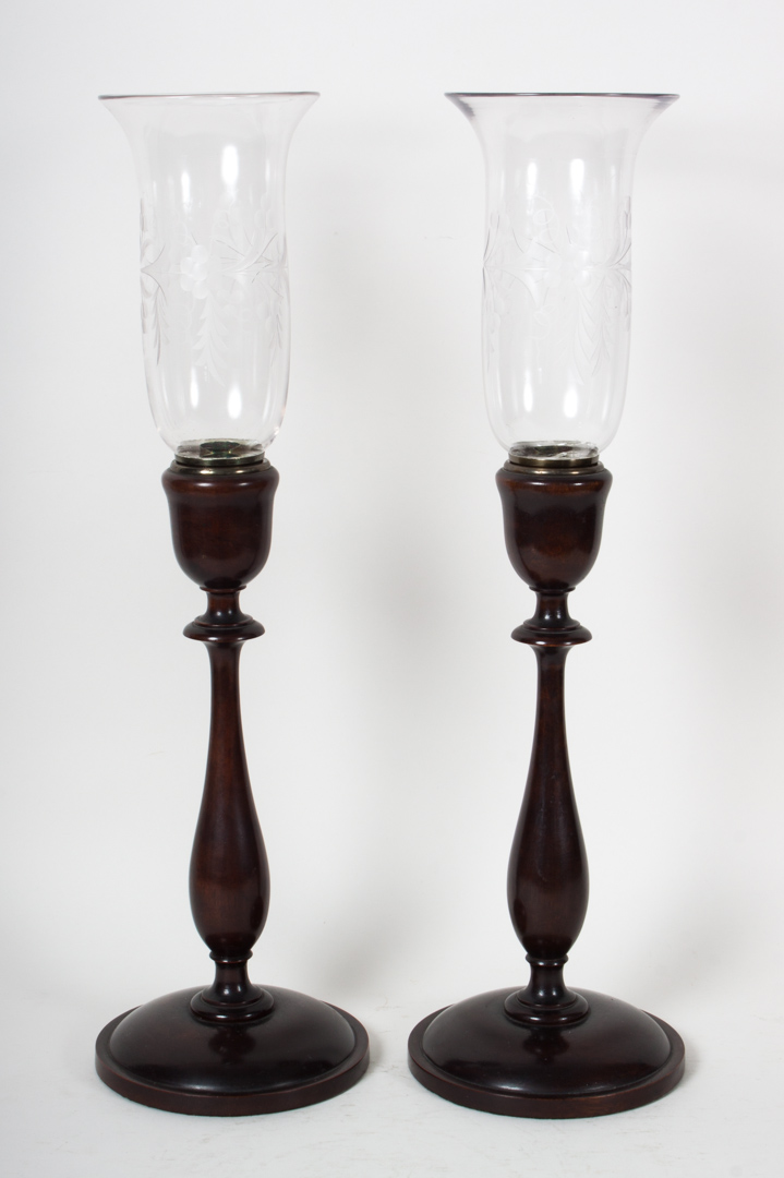 Appraisal: Pair of turned mahogany candlesticks with globes mahogany candlesticks with