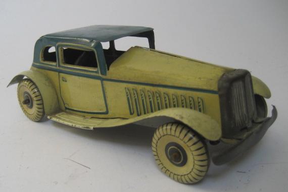 Appraisal: A Mettoy saloon tourer painted tinplate construction clockwork powered long