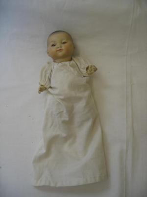 Appraisal: An Armand Marseille bisque head oriental baby doll with brown