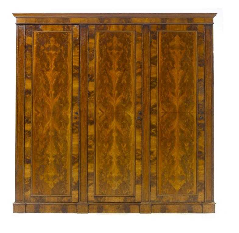 Appraisal: AN EARLY VICTORIAN FINELY FIGURED MAHOGANY WARDROBE in rich curl