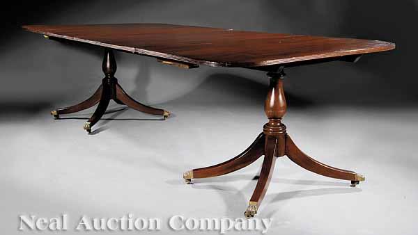 Appraisal: A Georgian-Style Mahogany Two Pedestal Dining Table the top with