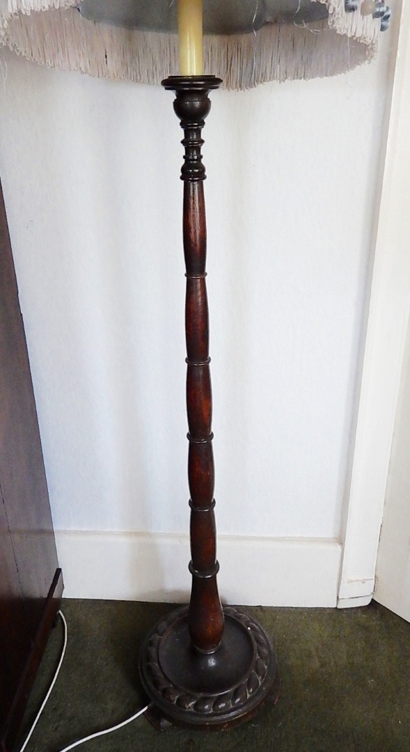 Appraisal: An oak floor lamp and shade with tapered and collard