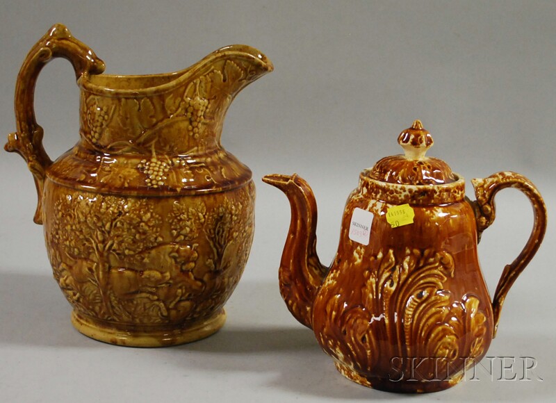 Appraisal: Rockingham Glazed Pottery Hunt Pitcher and a Teapot pitcher modeled