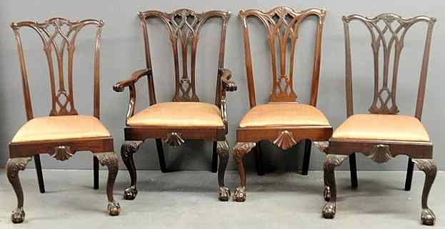 Appraisal: Set of four Chippendale style mahogany dining chairs one armchair