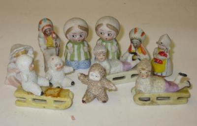 Appraisal: A set of five bisque Snow Babies four mounted on