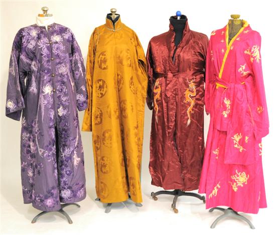 Appraisal: Four robes one magenta satin with orange dragon embroidery one