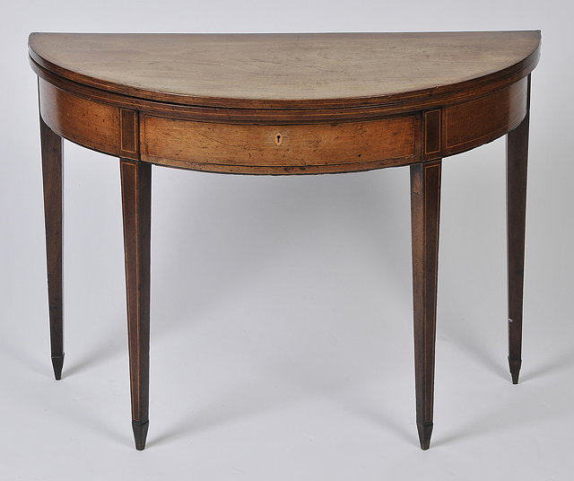 Appraisal: A GEORGE III MAHOGANY DEMI-LUNE TEA TABLE with string banded