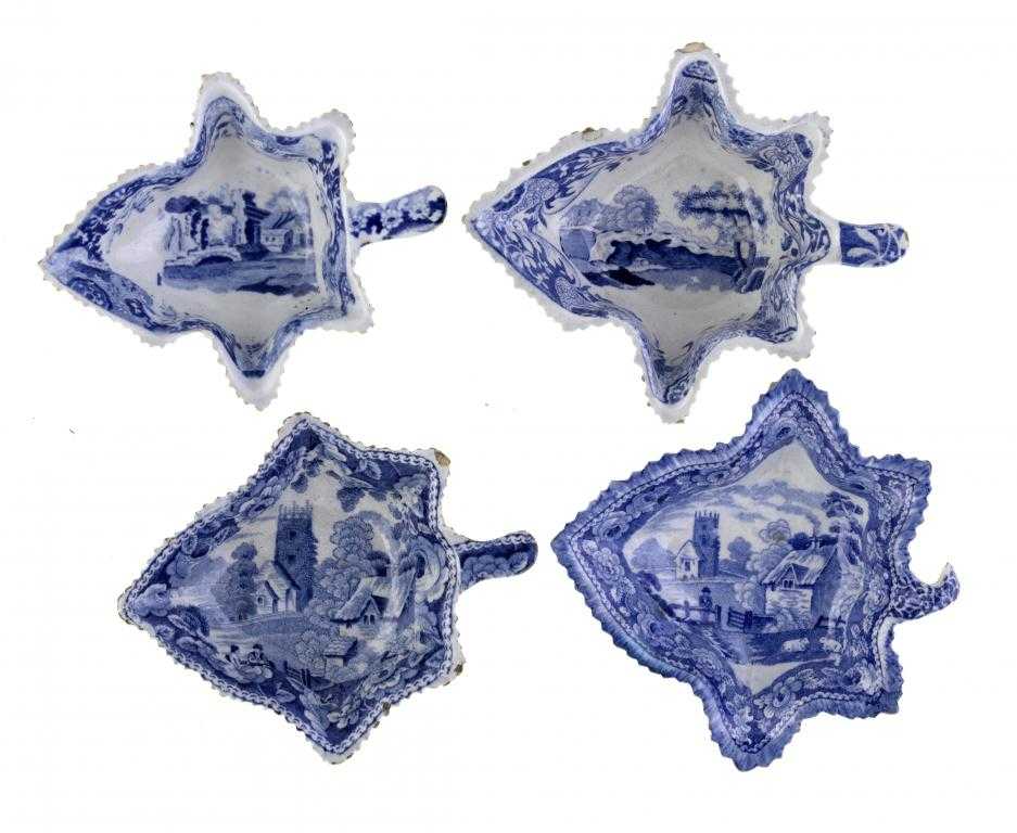 Appraisal: FOUR BLUE PRINTED EARTHENWARE PICKLE DISHES of vine leaf shape