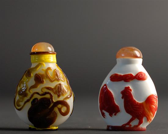 Appraisal: Two Cameo Cut Snuff Bottles a pear shape with yellow