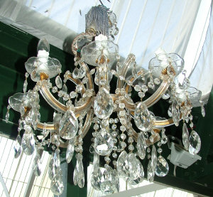 Appraisal: An eight brancch crystal chandelier the drip pans with lobed