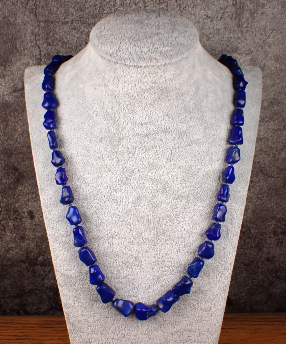 Appraisal: LAPIS BEADED NECKLACE strung with lapis pebble beads and ends