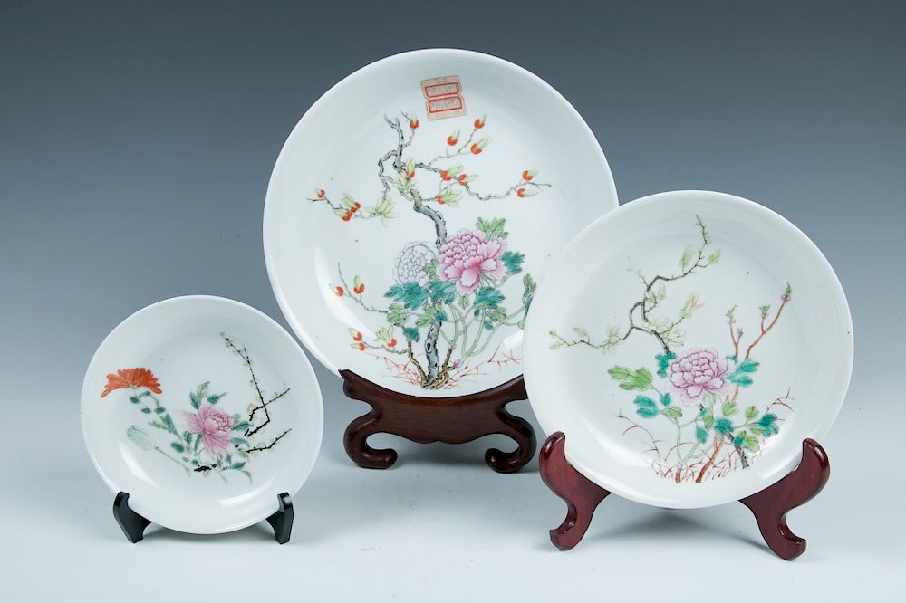 Appraisal: THREE FAMILLE ROSE FLORAL DISHES GUANGXU PERIOD The set comprising