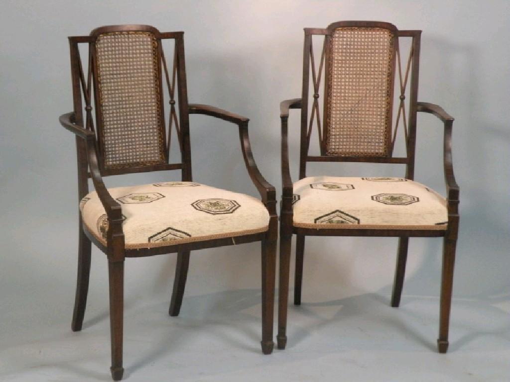 Appraisal: A pair of Edwardian mahogany cross banded open armchairs each