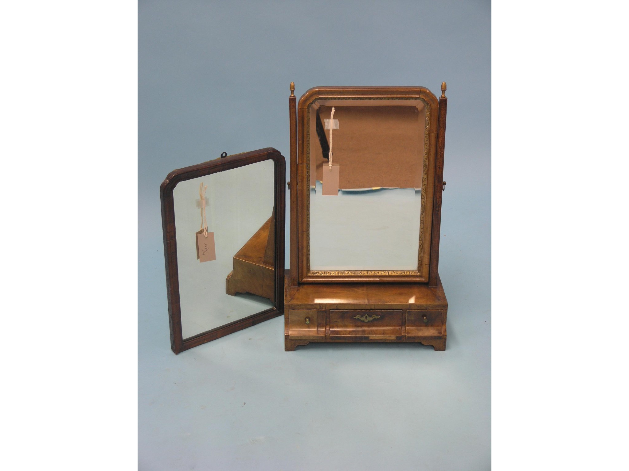 Appraisal: A George III mahogany toilet mirror bevelled mirror adjustable on