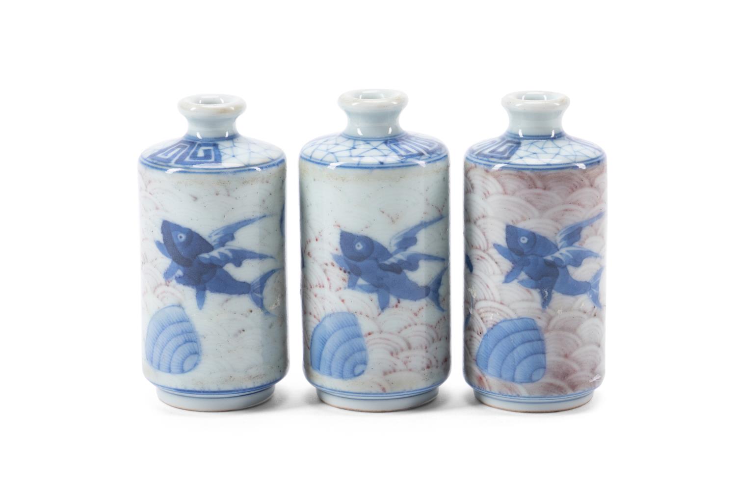 Appraisal: CHINESE BLUE WHITE IRON RED SNUFF BOTTLES Three Chinese blue