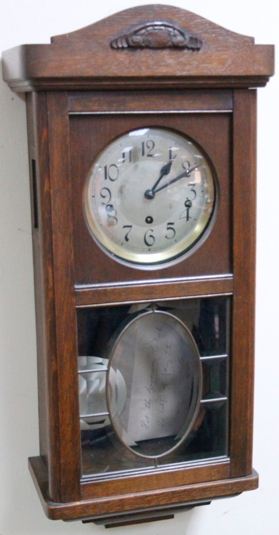 Appraisal: A thC stained oak wall clock the cm dia dial