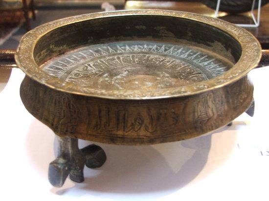 Appraisal: A KHORASSAN CIRCULAR BRASS LAMP BASE with finely incised decoration