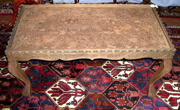 Appraisal: Highly Carved Asian Hardwood Coffee Table the top with an