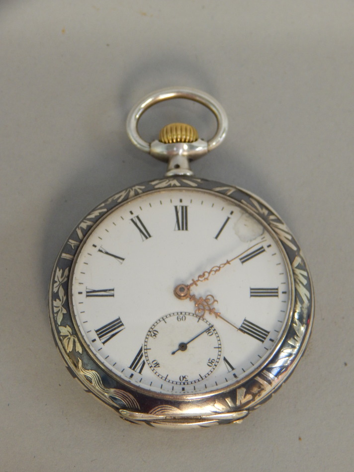 Appraisal: A Continental pocket watch in white metal case decorated in