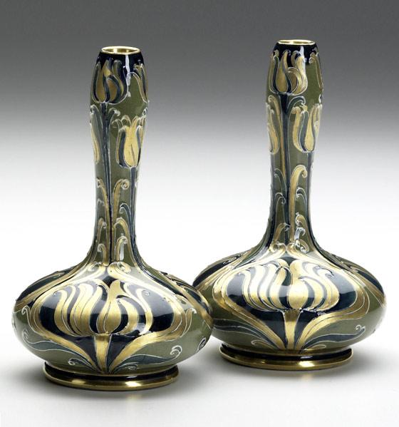 Appraisal: MOORCROFTMacINTYRETwo Florian bud vases gold indigo and celadonEach stamped MacINTYRE