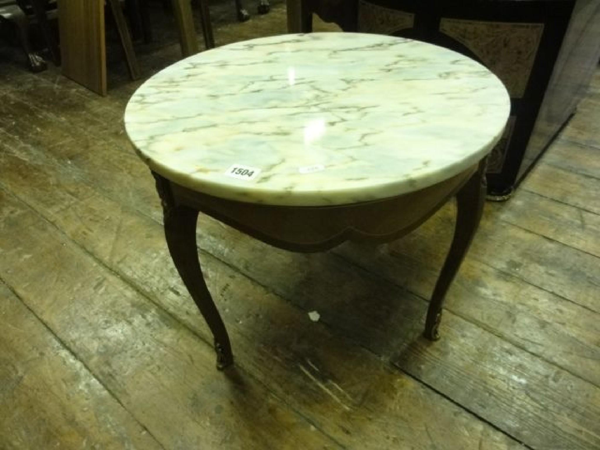 Appraisal: A small Louis XV style occasional table of circular form