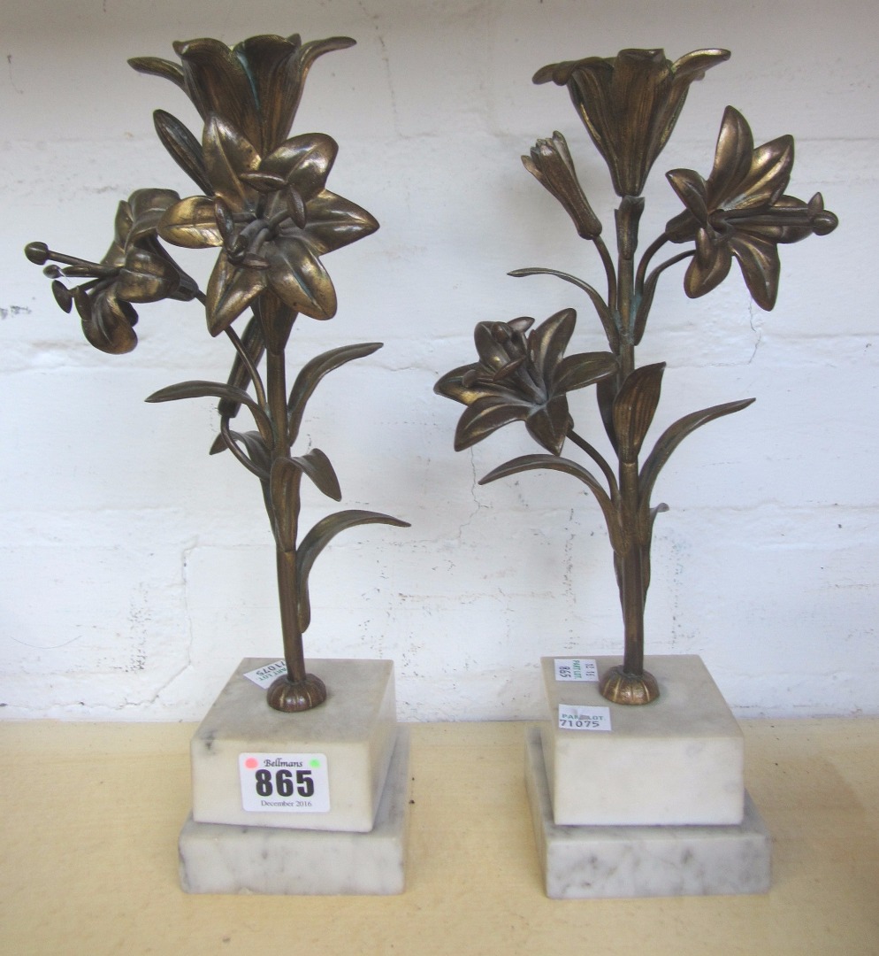 Appraisal: A pair of bronze foliate cast candlesticks early th century