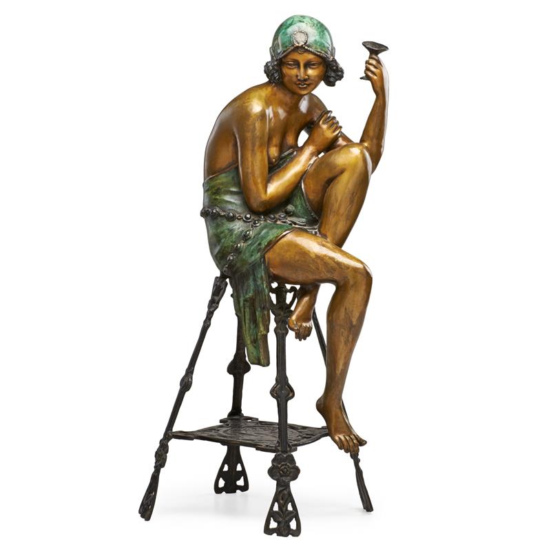 Appraisal: CONTINENTAL BRONZE SCULPTURE Art Deco style woman with legs crossed