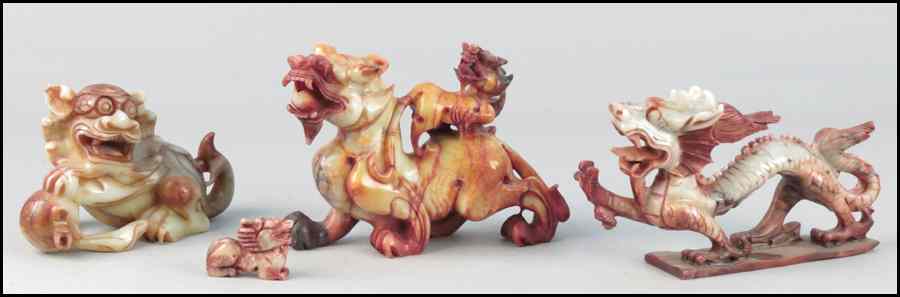 Appraisal: THREE CARVED SOAPSTONE DRAGONS Together with s carved soapstone foo