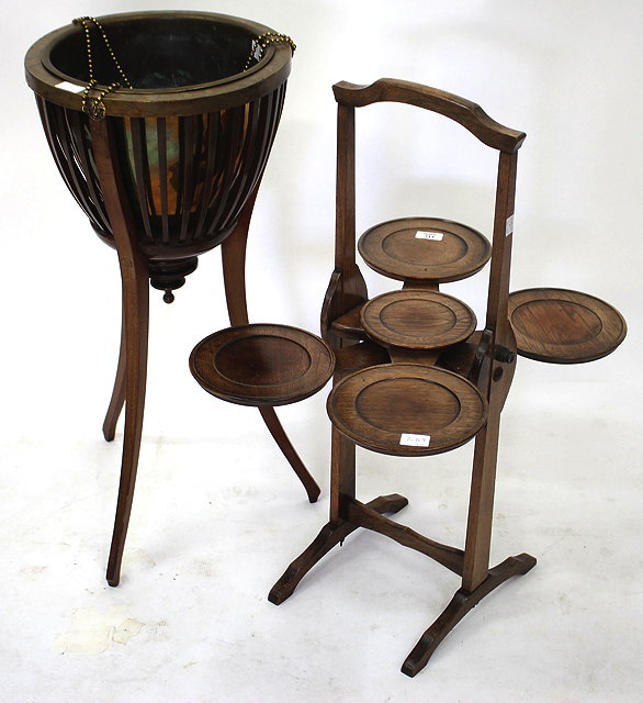 Appraisal: AN EDWARDIAN MAHOGANY JARDINIERE with circular top spun brass liner